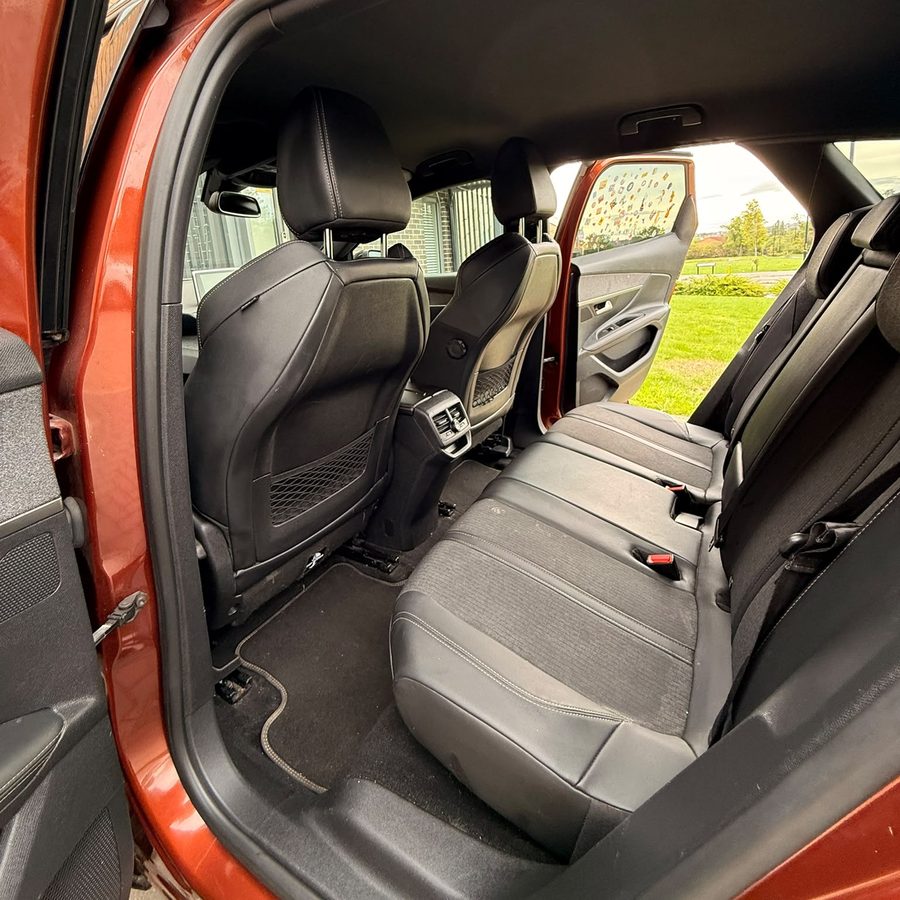 Vacuumed rear seats and floor mats in a Peugeot SUV